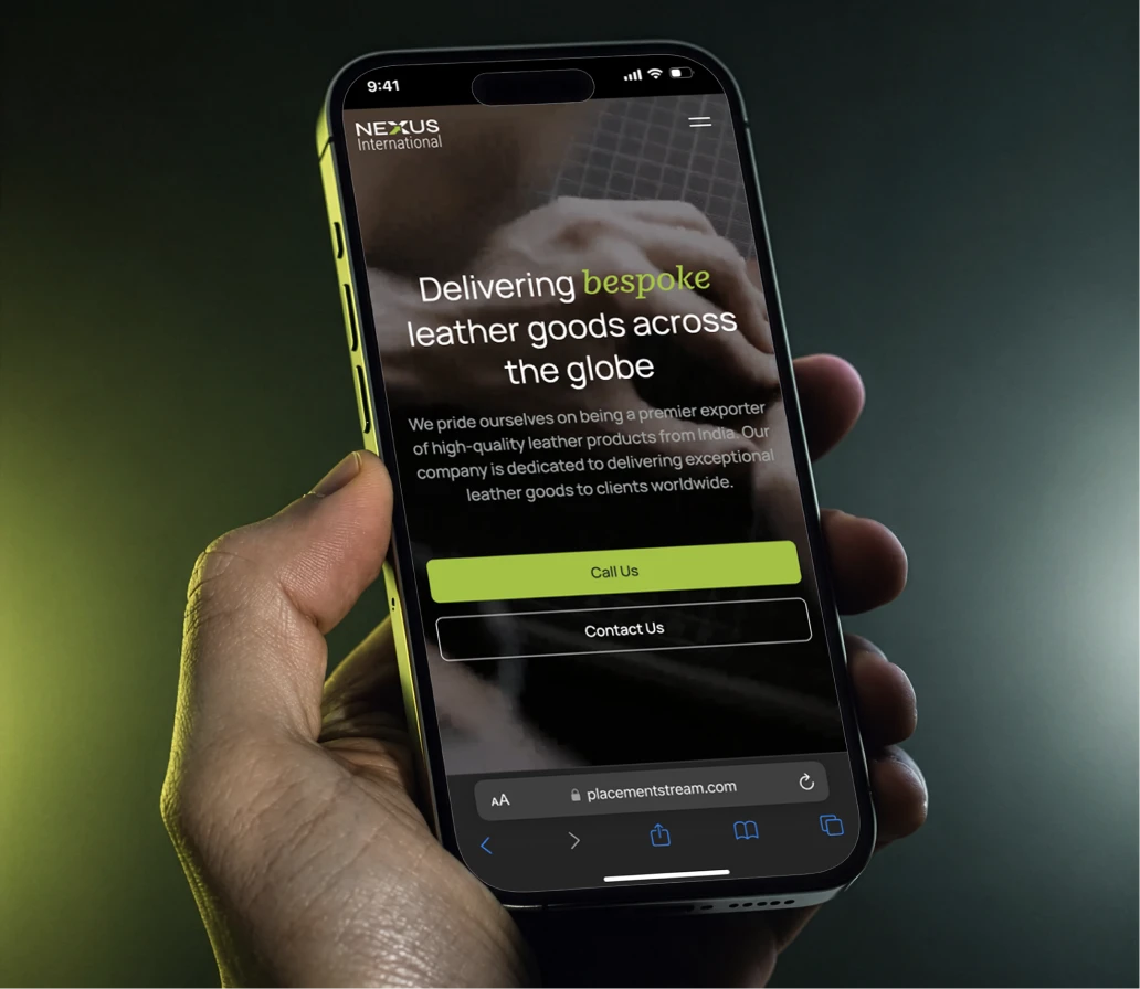 Nexus International website shown on a phone